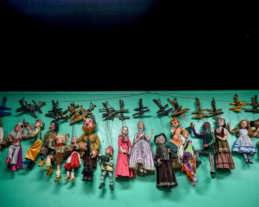 puppets hanging in a row