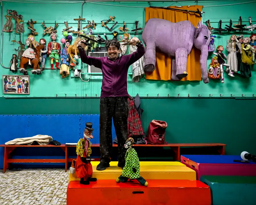 a puppeteer with puppets