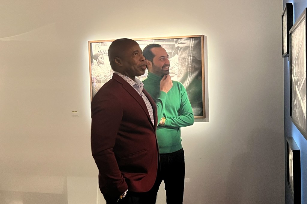Johnny Petrosyants looks at artwork with then-Mayor Eric Adams in 2023.
