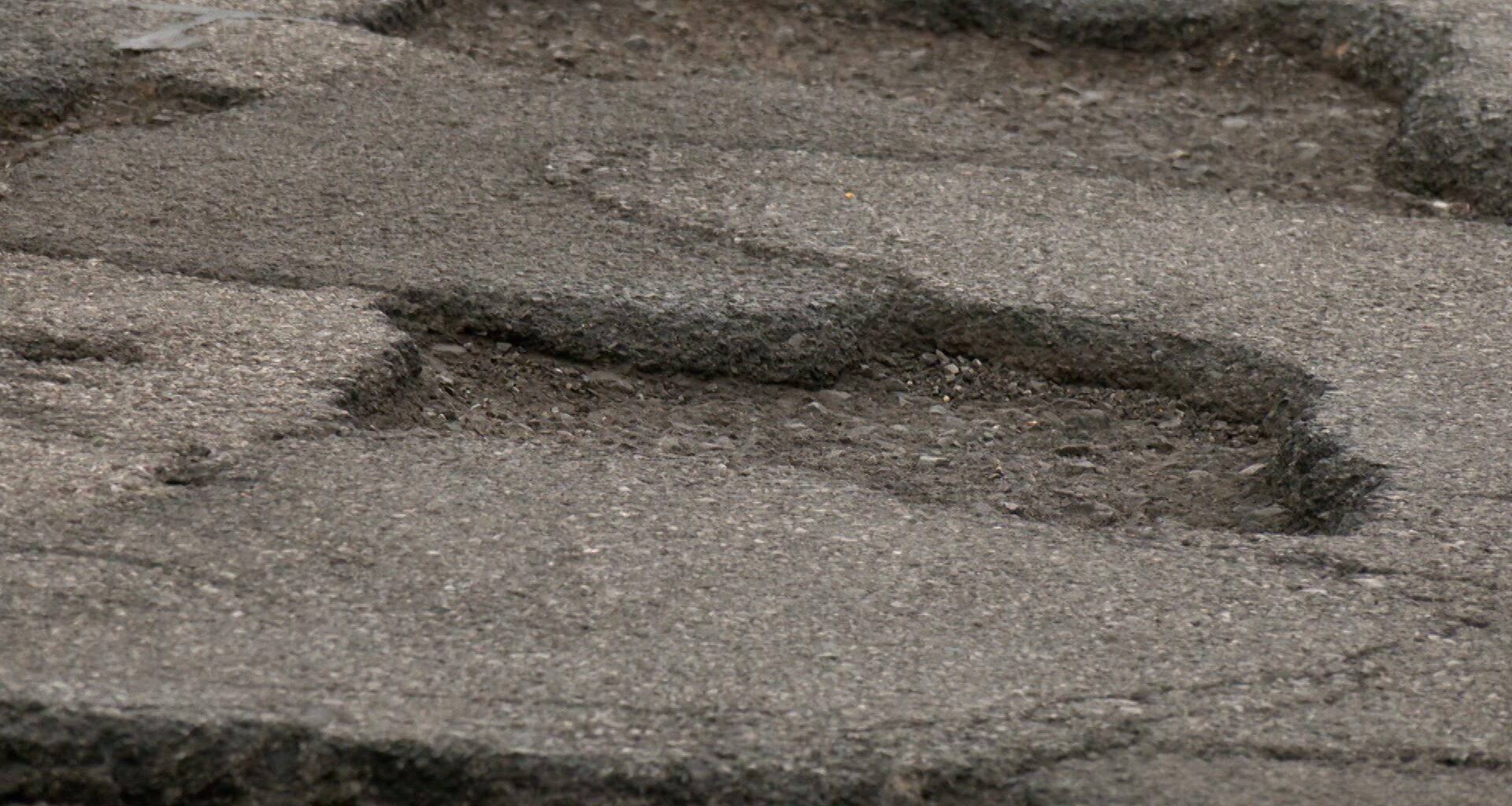 New York bill would make state liable for pothole damage and road defects year-round