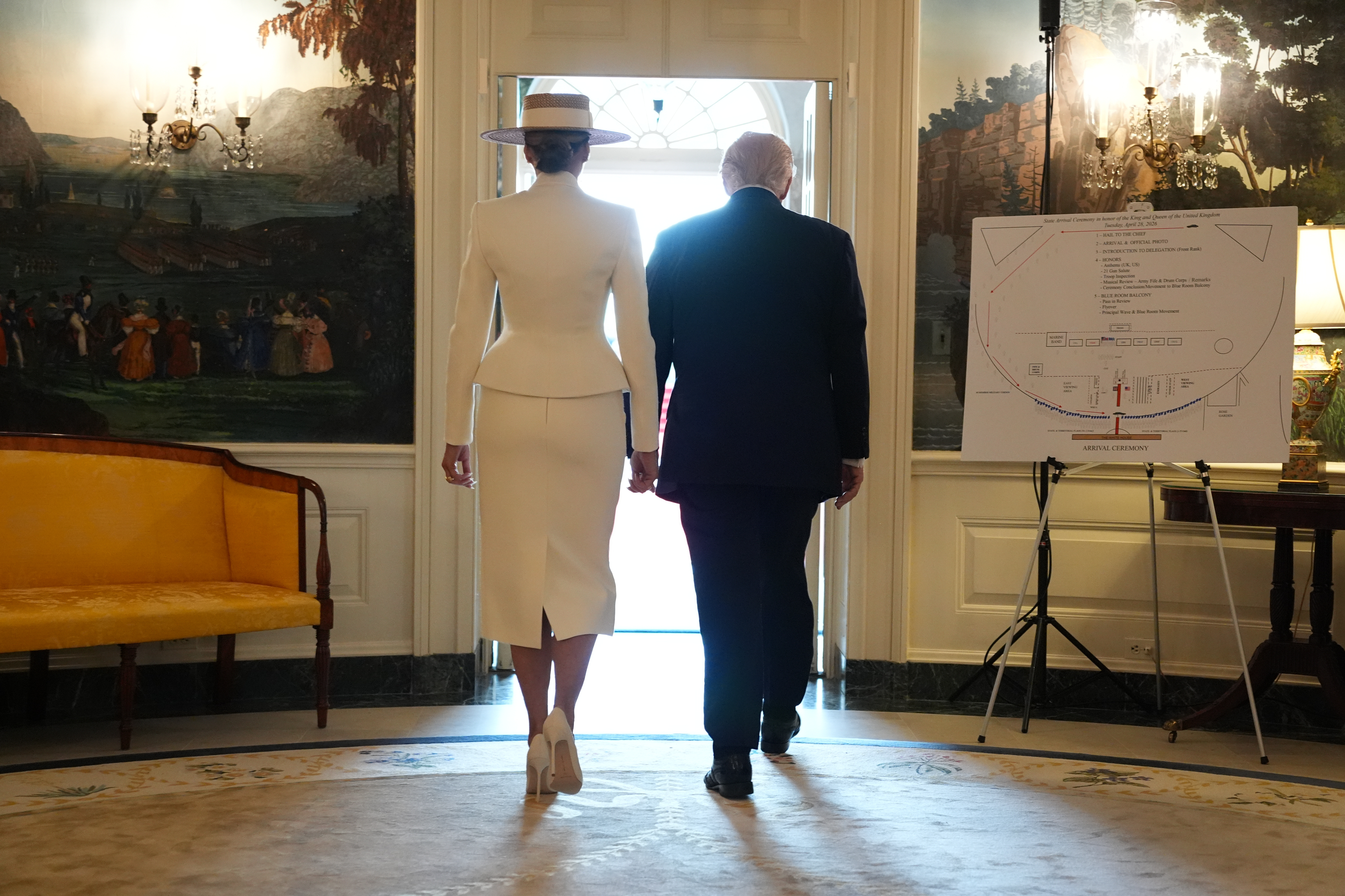 President Donald Trump and First Lady Melania Trump walk from the Diplomatic Reception Room to greet Britain's King Charles III and Queen Camilla during a State Visit at the White House.