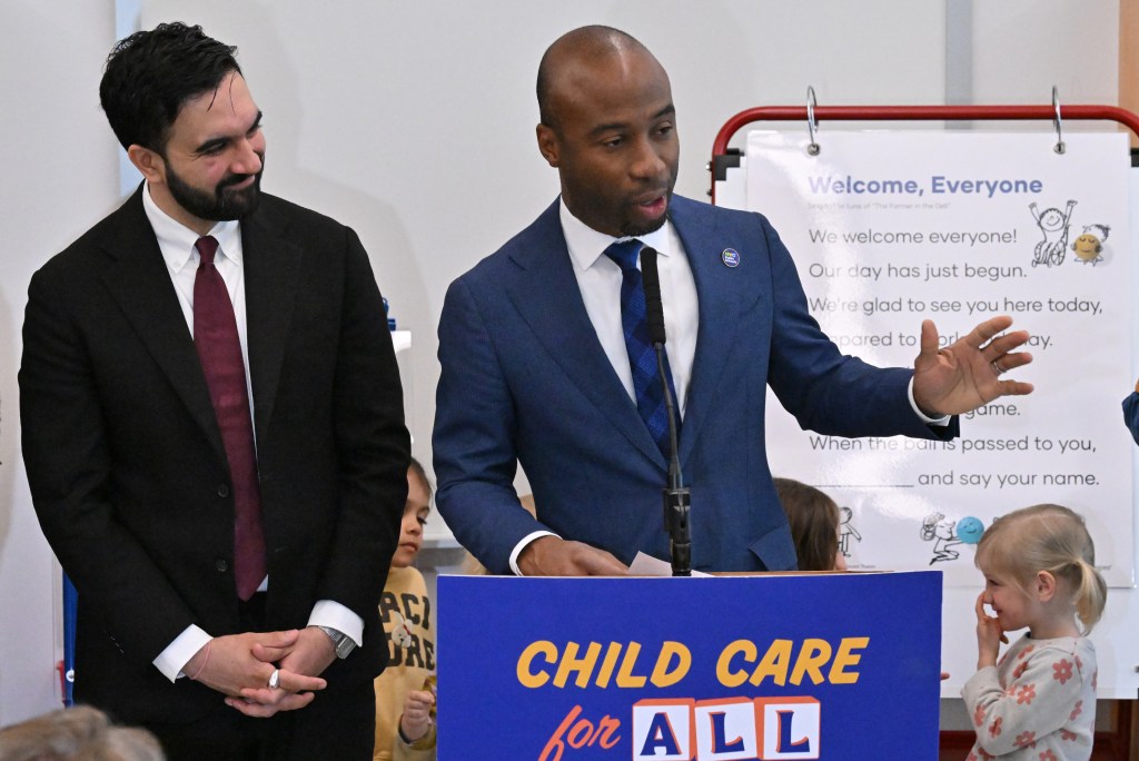 NYC School Chancellor Kamar Samuels speaking at a "Child Care for All" event alongside Zorhan Mamdani.