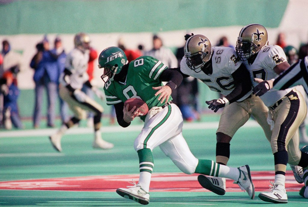 New York Jets quarterback Browning Nagle running from Saints Pat Swilling and Rickey Jackson.