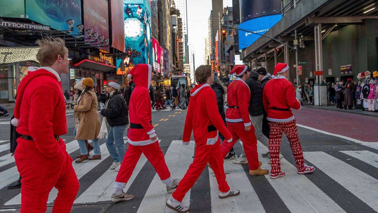 Revelers take part in SantaCon, Dec. 14, 2024, in New York. (AP Photo/Julia Demaree Nikhinson, File)