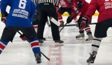 a faceoff at a senior hockey game