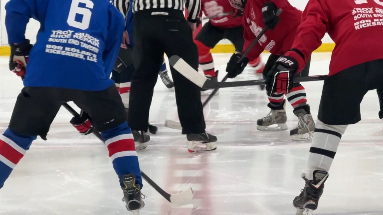 a faceoff at a senior hockey game