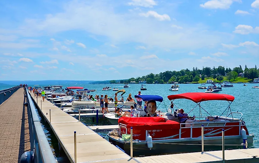 Pier and luxury boats docked in the Skaneateles Lake in Skaneateles, New York