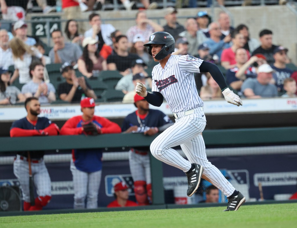 Somerset Patriots shortstop George Lombard Jr. #3 running on the field.