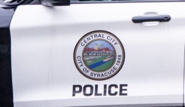 driver's side door of syracuse police car