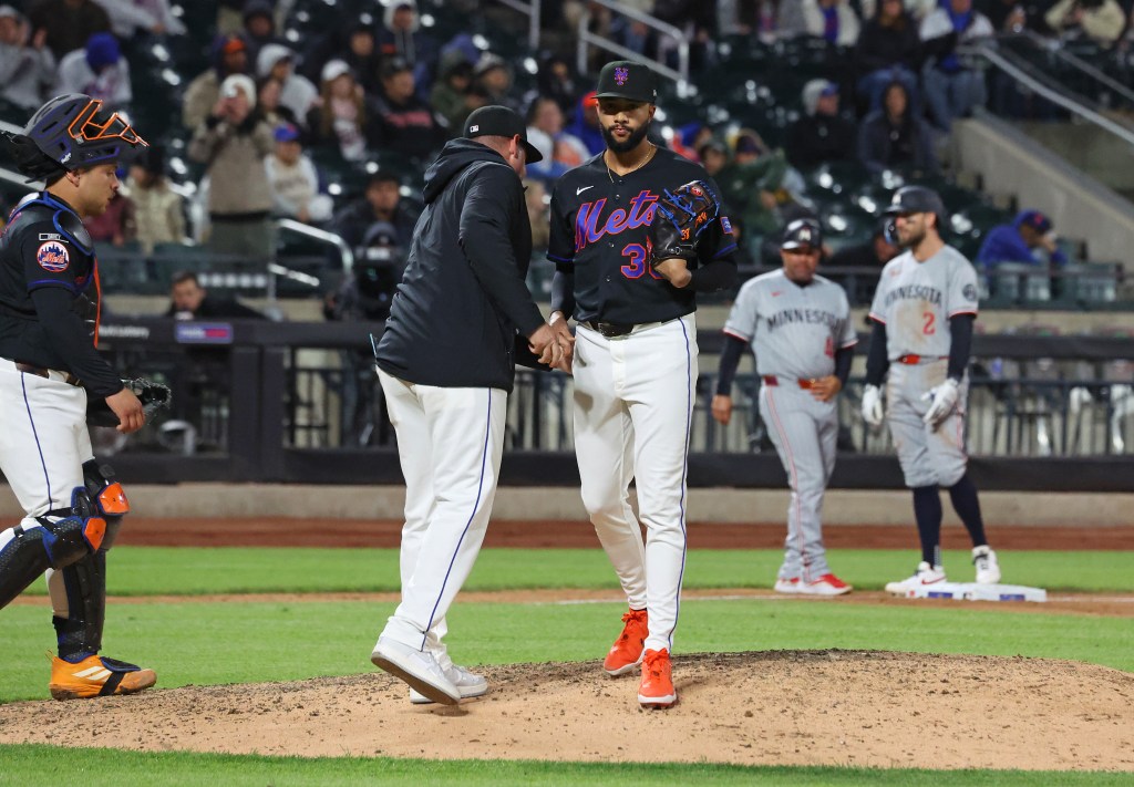 New York Mets pitcher Devin Williams (38) is taken out of the game.