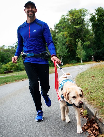 man and dog running