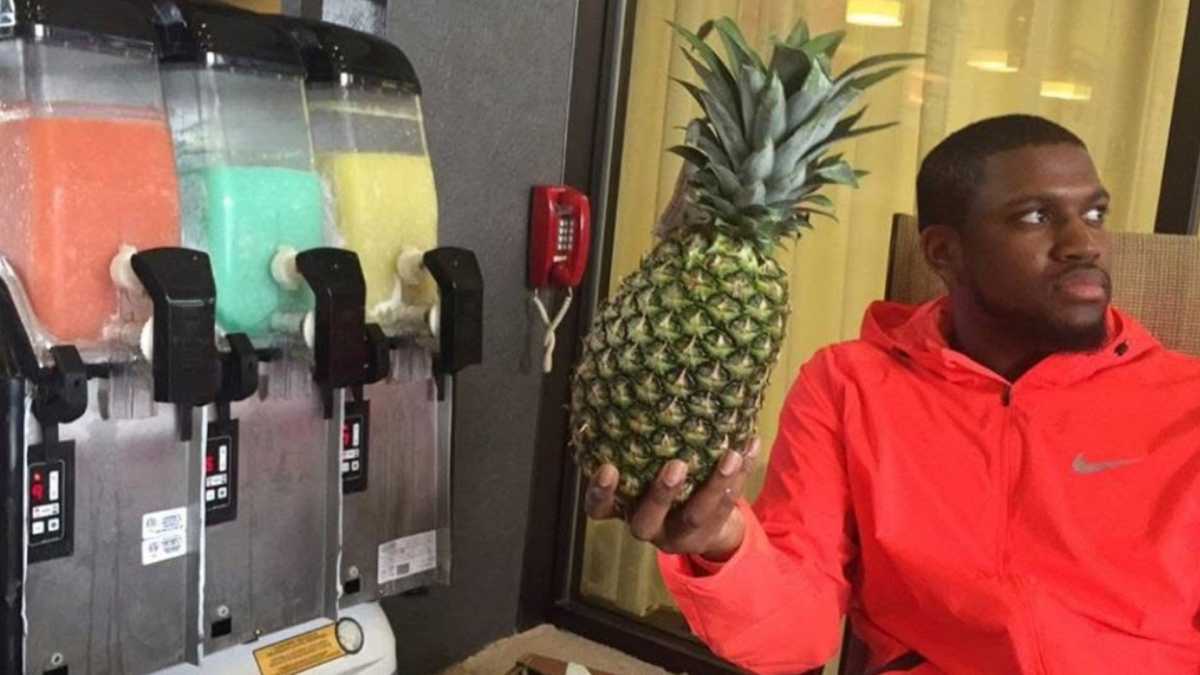 Chef Tonay holding a pineapple