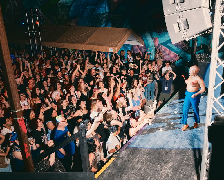 The crowd at the yard of 3 Dollar Bill cheer during "I Want You for Turning Point U.S. Gay NYC: A right-wing parody show for charity"