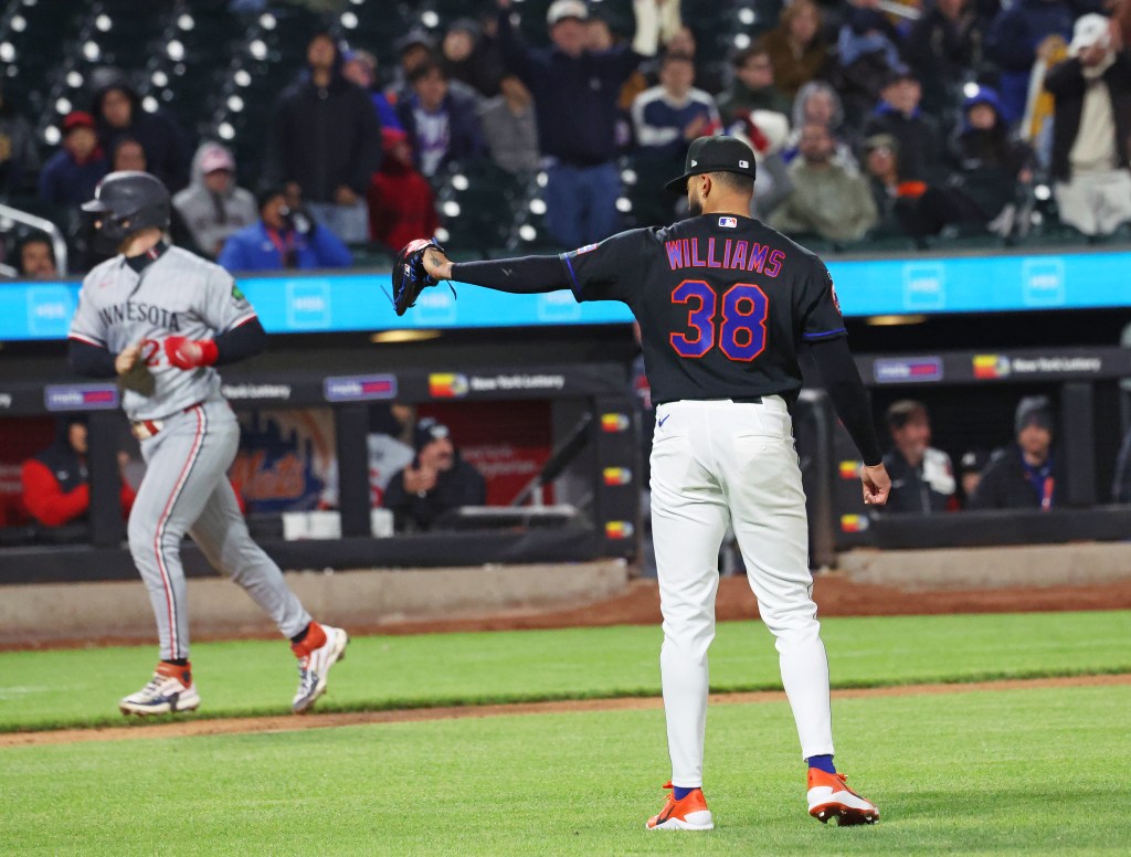 New York Mets pitcher Devin Williams (38) walks in a run during the ninth inning.