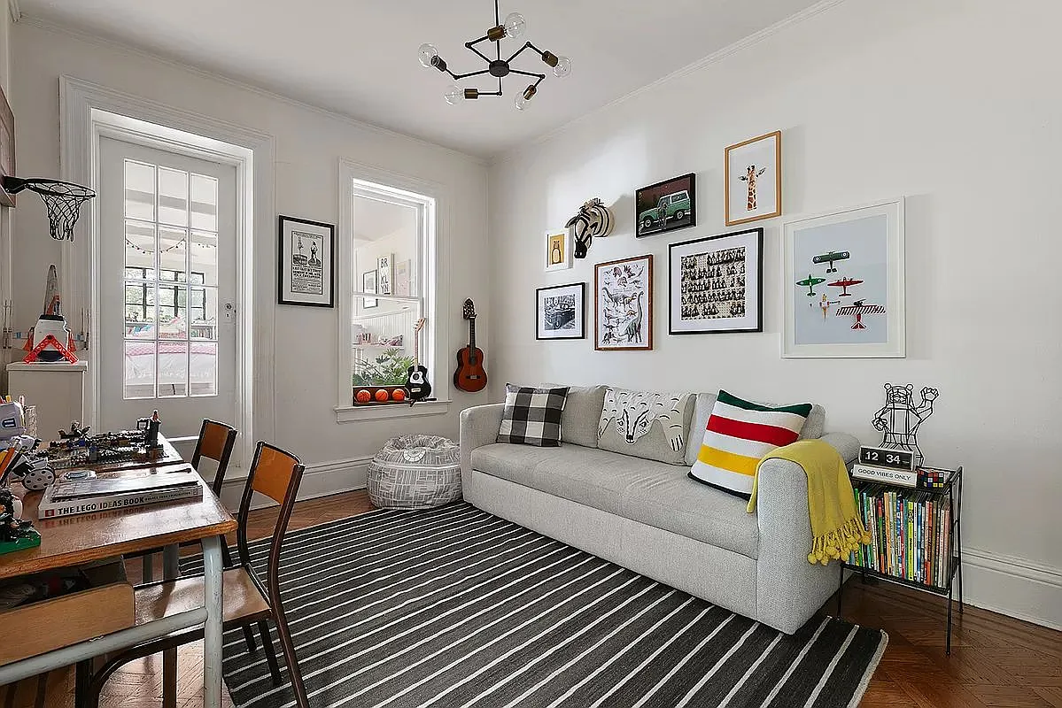 bedroom set up as an office with a door to the sleeping porch