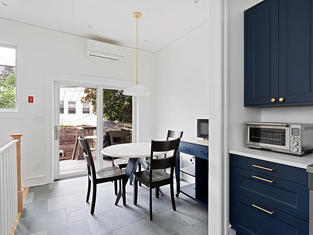 kitchen with blue cabinets, white counters and a breakfast nook