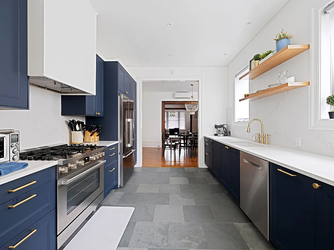 kitchen with blue cabinets, white counters
