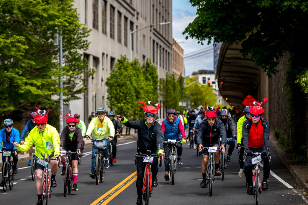 Cyclists wearing lobster-themed hats in the Annual Five Boro Bike Tour on May 3, 2026 in New York City.