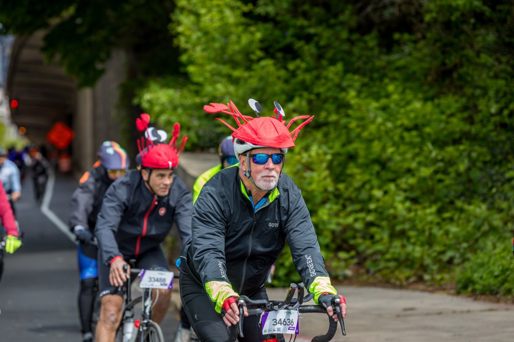 Cyclists wearing lobster-themed hats in the Annual Five Boro Bike Tour on May 3, 2026 in New York City.