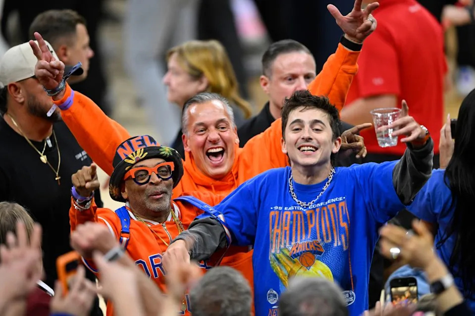 Filmmaker Spike Lee and actor Timothee Chalamet react after the New York Knicks defeat the Cleveland Cavaliers in game four of the Eastern Conference Finals for the 2026 NBA playoffs at Rocket Arena. David Richard-Imagn Images