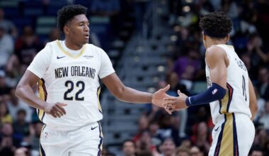 Dec 26, 2025; New Orleans, Louisiana, USA;  New Orleans Pelicans center Derik Queen (22) celebrates a basket with guard Jeremiah Fears (0) during the first half against the Phoenix Suns at Smoothie King Center. Mandatory Credit: Matthew Hinton-Imagn Images