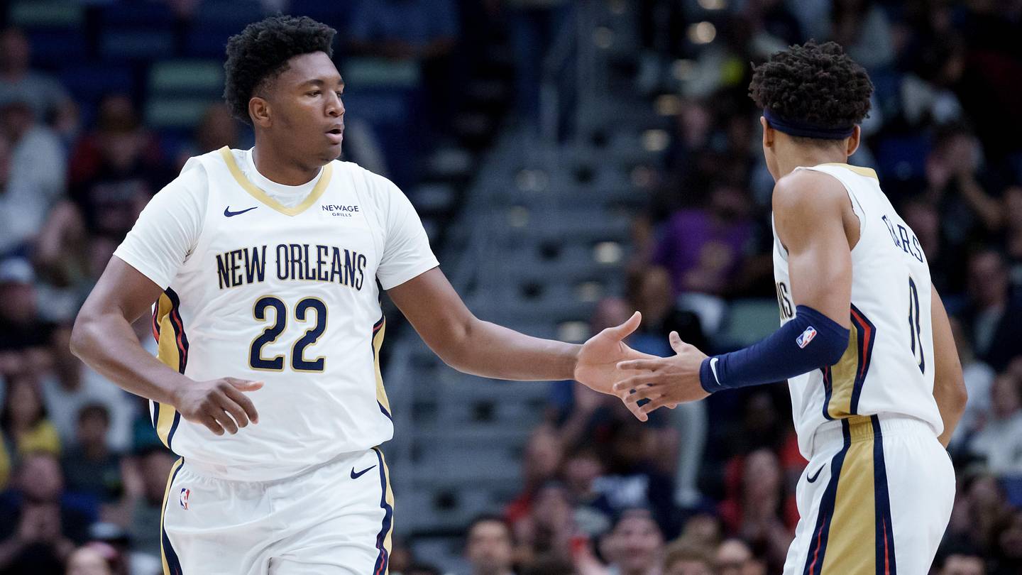 Dec 26, 2025; New Orleans, Louisiana, USA;  New Orleans Pelicans center Derik Queen (22) celebrates a basket with guard Jeremiah Fears (0) during the first half against the Phoenix Suns at Smoothie King Center. Mandatory Credit: Matthew Hinton-Imagn Images