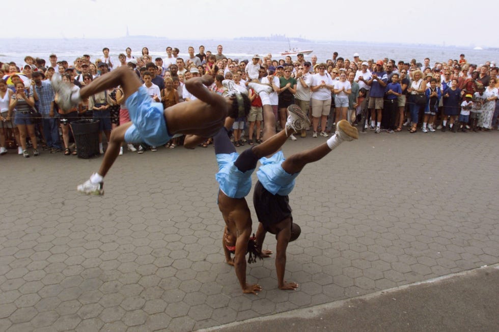 united states july 30 street performers have a readymade audience of tourists waiting to take the boat to the statue of liberty on the next to last day of the hottest july on record photo by evy magesny daily news archive via getty images