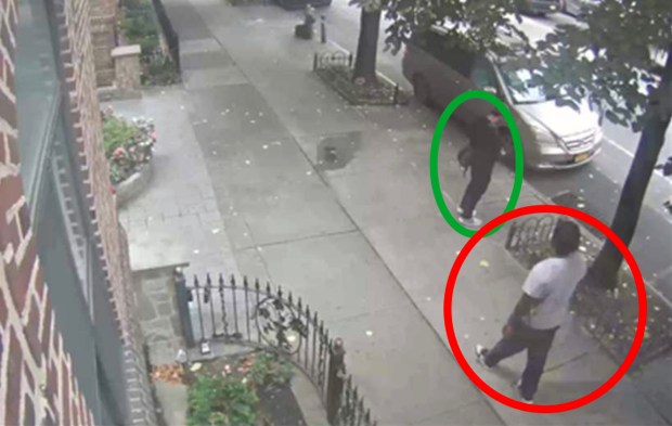 In a surveillance image, Darren McKenzie (circled in red) is seen approaching an FBI agent (circled in green) on Ocean Ave. in Brooklyn before punching him in the face in September 2025.