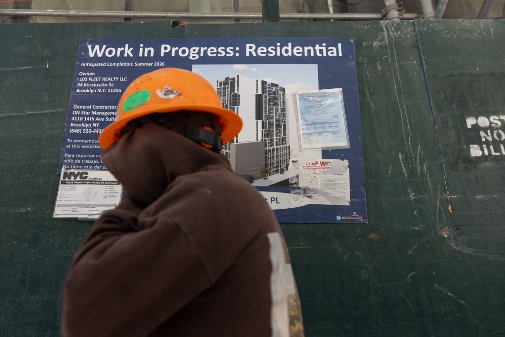 Construction workers take a lunch break at a residential development along Flatbush Avenue in Brooklyn