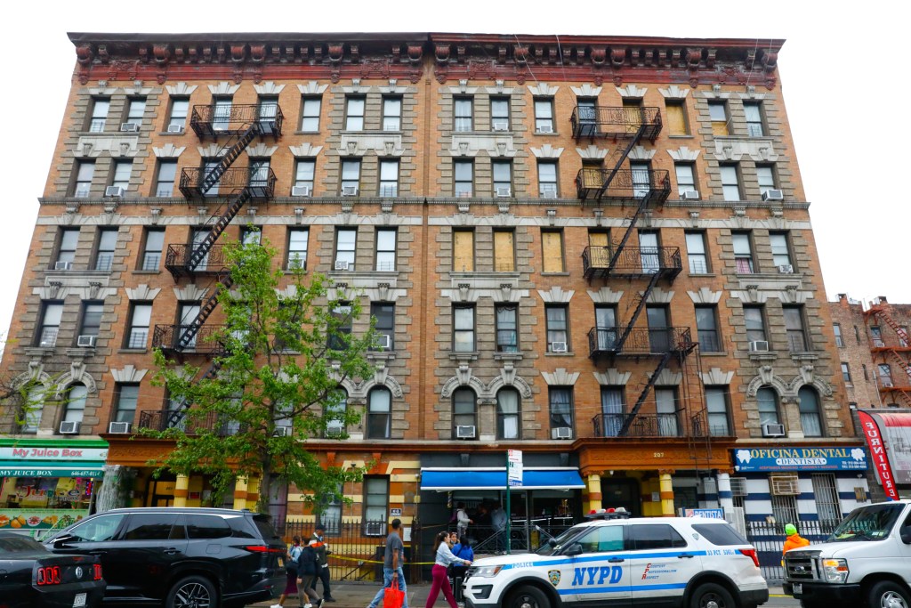 Windows were boarded up at 207 Dyckman Street in Upper Manhattan after a fire killed several people in the building.