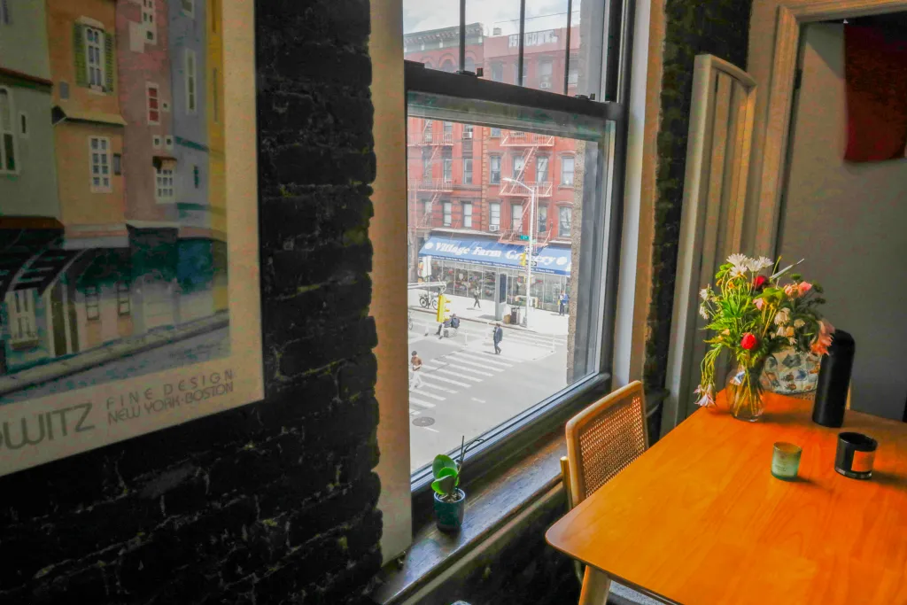 Three east village roommates had a view of 2nd Avenue from their kitchen.