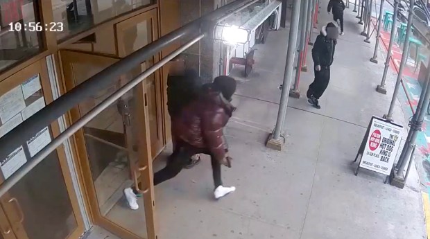 A gunman, alleged by prosecutors to be Christopher Moore, chases a group of rivals outside the the Center for Justice Innovation on Elm Place in Downtown Brooklyn on March 2, 2026.