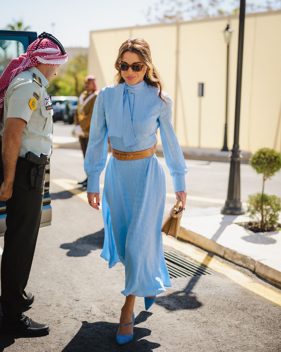 Queen Rania of Jordan’s blue look: silk dress, Lebanese shoes, and iconic bag at the opening of the Hashemite Parliament