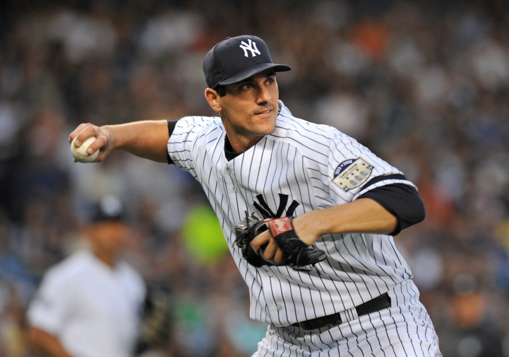 Yankees pitcher Carl Pavano throwing a baseball.