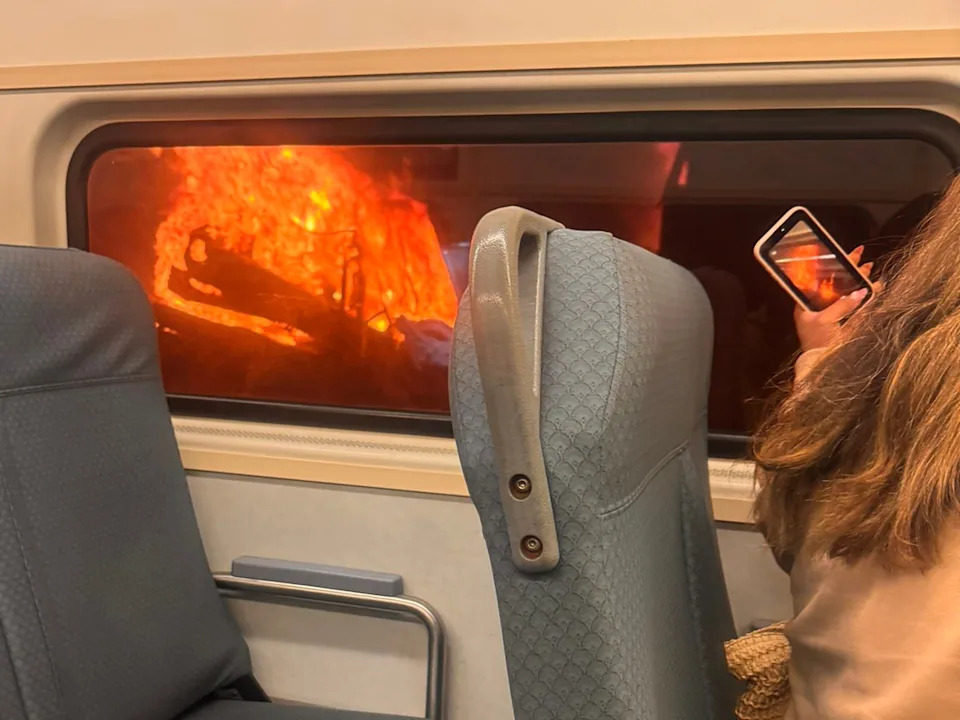 @grep_now/X - PHOTO: A passenger on a train photographs a fire on a maintenance vehicle in a tunnel under Penn Station in New York City, May 29, 2026.