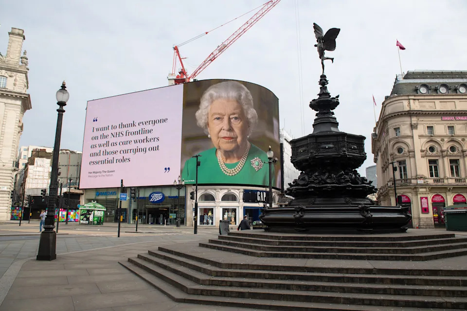 An image of Queen Elizabeth II and quotes from her broadcast on Sunday to the UK and the Commonwealth in relation to the coronavirus epidemic are displayed on lights in London's Piccadilly Circus.
