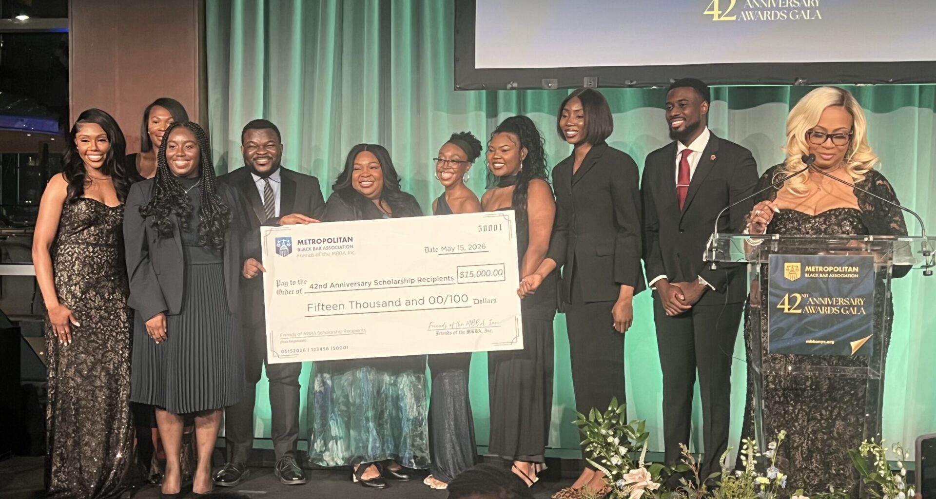 Evette C. Ennis, Esq., president of Friends of MBBA, alongside 2026 scholarship award recipients. Photo: Wayne Daren Schneiderman/Brooklyn Eagle