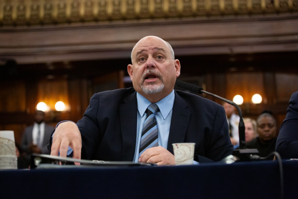 Department of Correction Deputy Commissioner of Legal Matters James Conroy testifies at a City Council hearing on Rikers Island visitation procedures