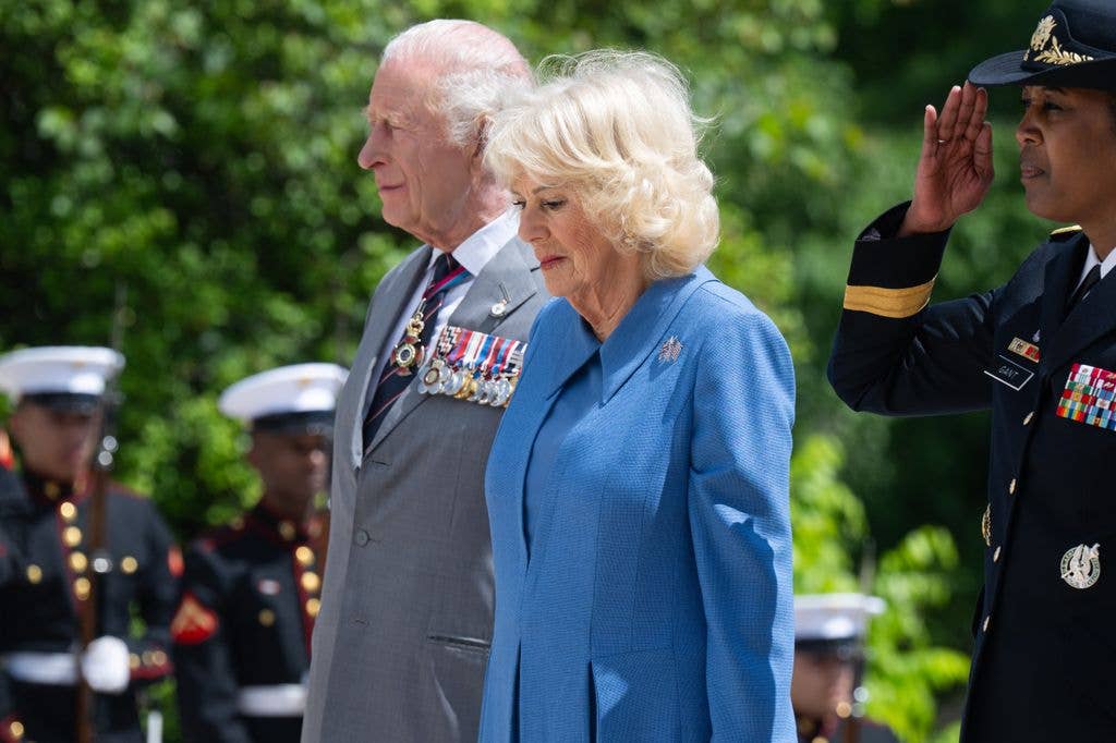 king Charles III and Queen Camilla pay their respects at the Tomb of the Unknown Soldier