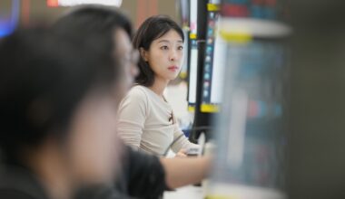 Shares mostly gain in Asia after Wall St hits new records, while oil slips