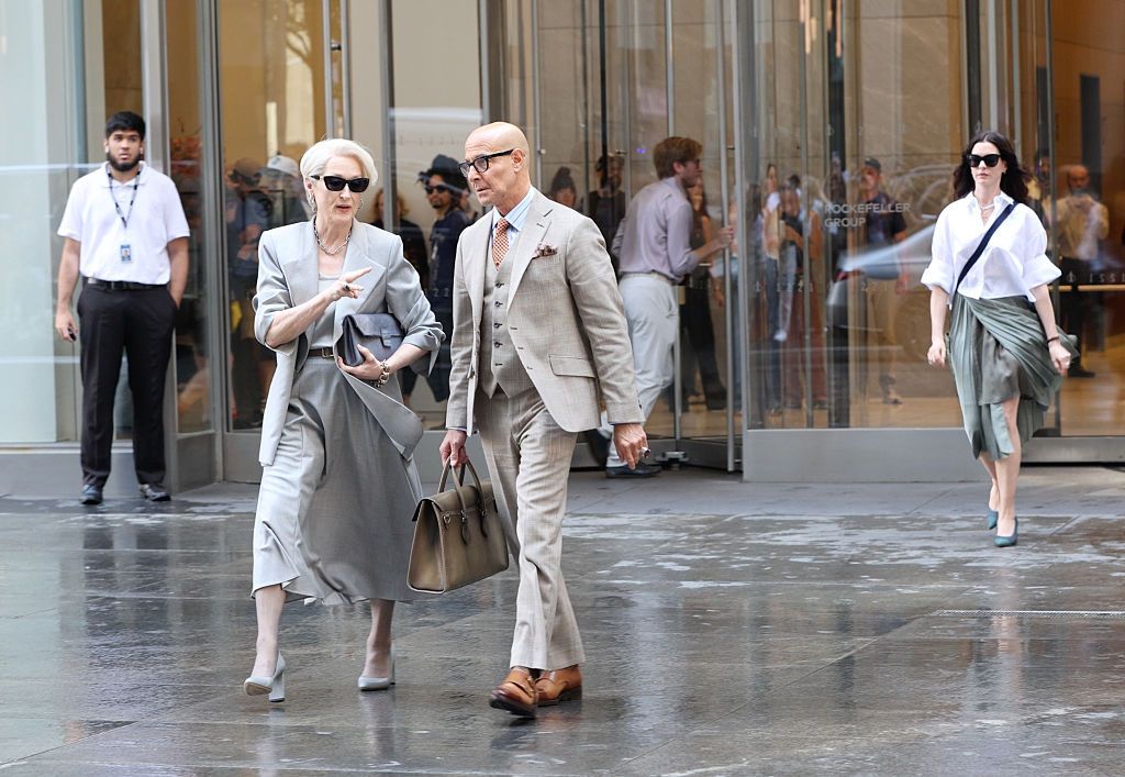 Image may contain Stanley Tucci Meryl Streep Adult Person Pedestrian Walking Clothing Formal Wear and Suit