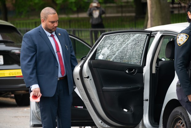 Police investigate bullet holes in a car after a 14-year-old was shot on Rosedale Ave. in the Soundview neigborhood in the Bronx on Wednesday, May 6, 2026. (Gardiner Anderson / New York Daily News)