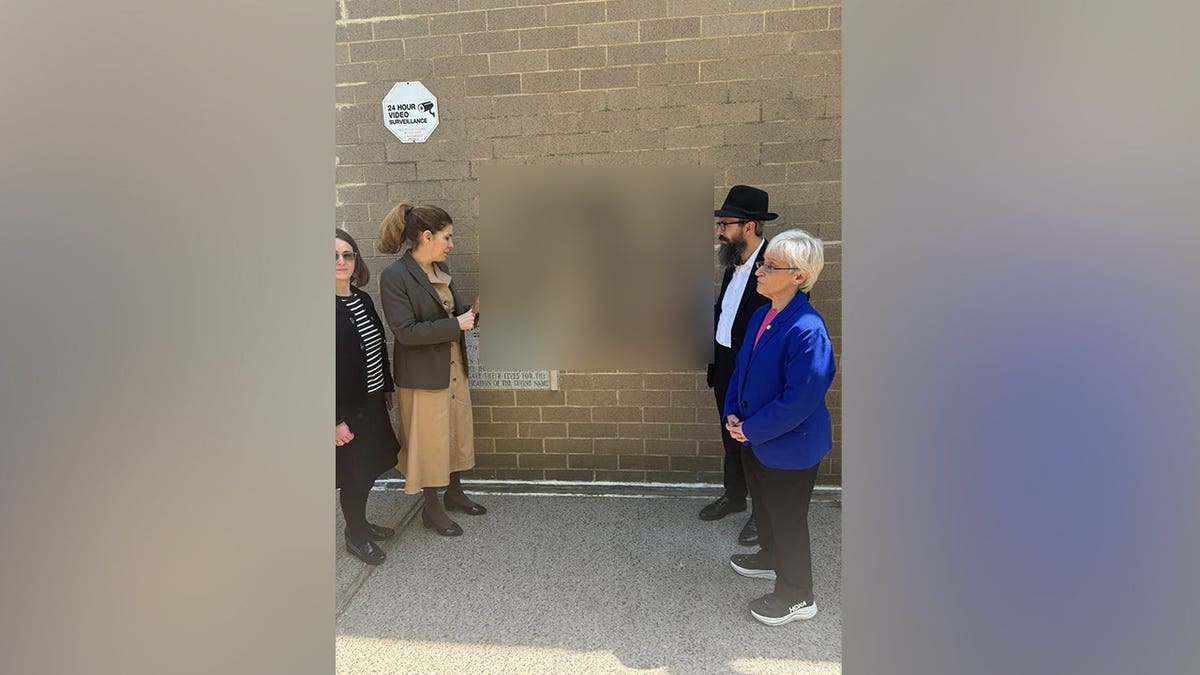 Four suspects spray-painting swastikas on buildings and cars in Queens New York