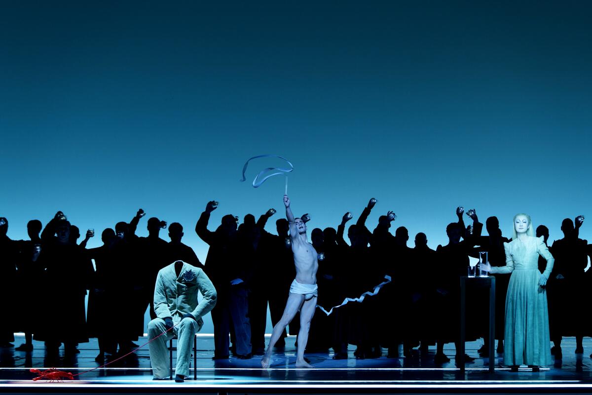 Soprano Ying Fang and dancer Alexis Fousekis in Robert Wilson's production of Handel's 'Messiah' at Houston Grand Opera