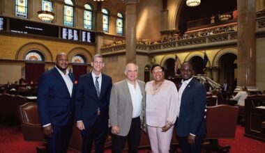 (L. to r.): Aaron Ambrose, Queens Regional Representative for Governor Hochul; Assemblyman Braunstein, Ron Naclerio, and Assemblymembers Hooks and Ander­son are photographed on the Assembly Floor.