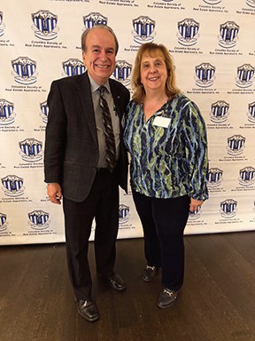 Paul Halvatzis of Amorelli Realty with Jenn DeFlorio, Ex­ecutive Director of the Columbia Society of Real Estate Ap­praisers.