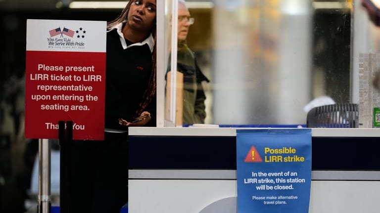 A sign warns commuters of a potential Long Island Rail...