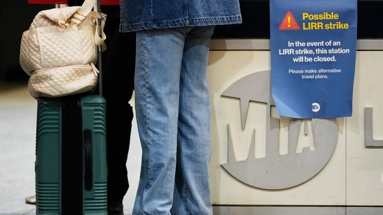 A sign warns commuters of a potential Long Island Rail...
