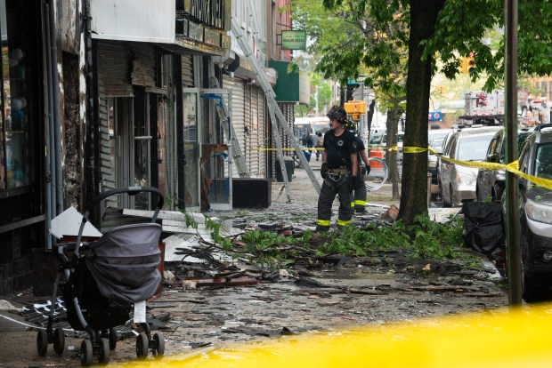 Firefighters respond to a fatal fire on 3rd Ave. near E. 140th St. in the Bronx on Wednesday, May 6, 2026. (Gardiner Anderson / New York Daily News)