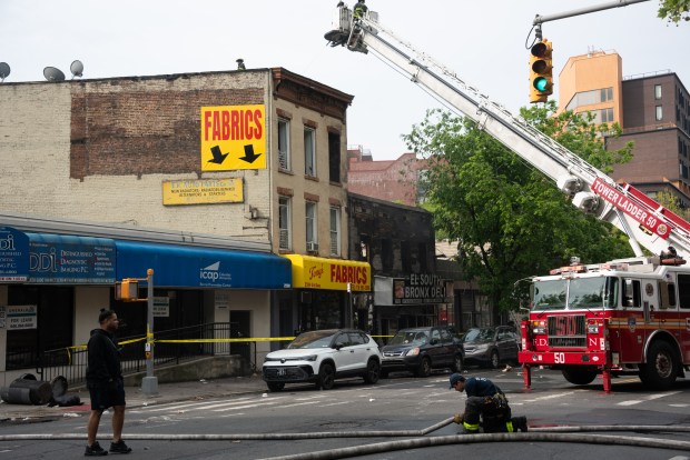 Firefighters respond to a fatal fire on 3rd Ave. near E. 140th St. in the Bronx on Wednesday, May 6, 2026. (Gardiner Anderson / New York Daily News)